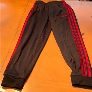 Black and red Adidas jogger pants